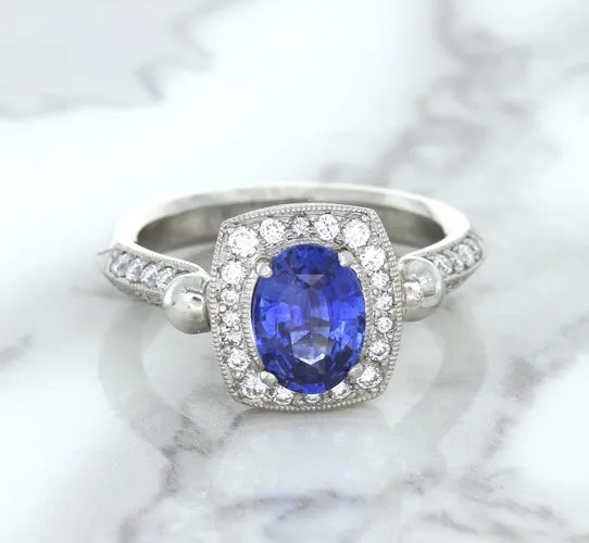 1.56ct Oval Blue Sapphire Ring with Diamond Halo in Platinum