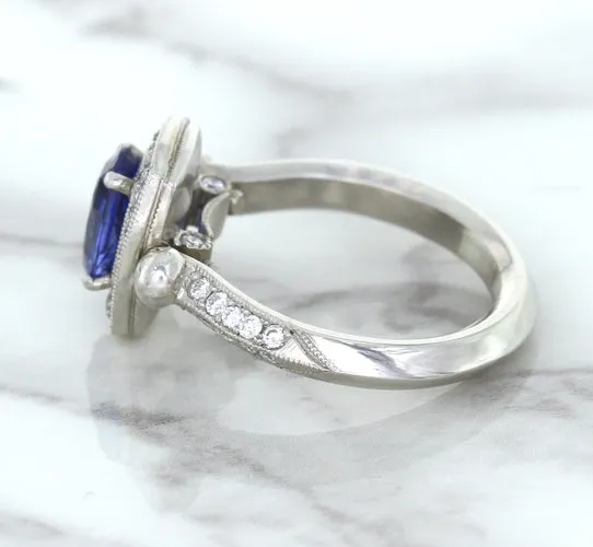1.56ct Oval Blue Sapphire Ring with Diamond Halo in Platinum