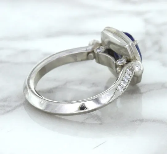 1.56ct Oval Blue Sapphire Ring with Diamond Halo in Platinum