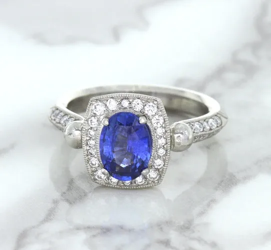 1.56ct Oval Blue Sapphire Ring with Diamond Halo in Platinum