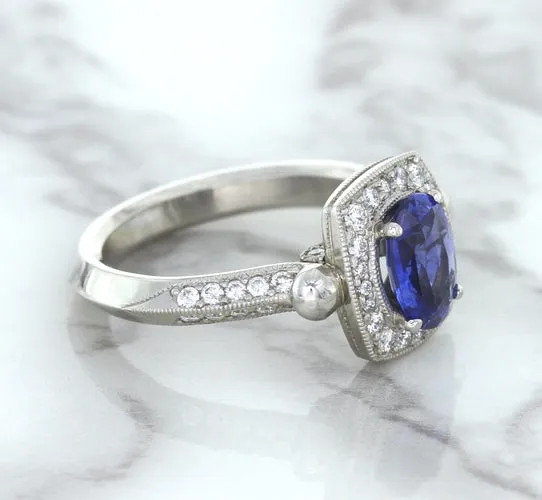 1.56ct Oval Blue Sapphire Ring with Diamond Halo in Platinum