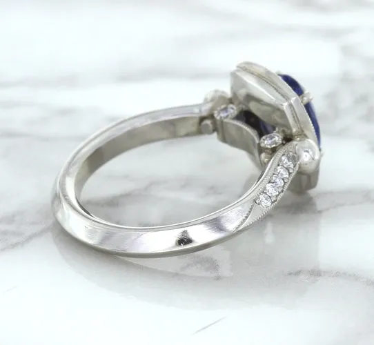 1.56ct Oval Blue Sapphire Ring with Diamond Halo in Platinum