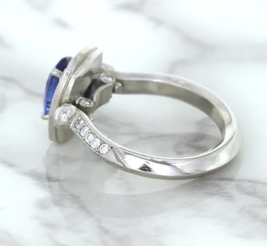 1.56ct Oval Blue Sapphire Ring with Diamond Halo in Platinum