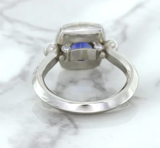 1.56ct Oval Blue Sapphire Ring with Diamond Halo in Platinum