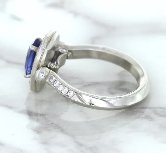 1.56ct Oval Blue Sapphire Ring with Diamond Halo in Platinum