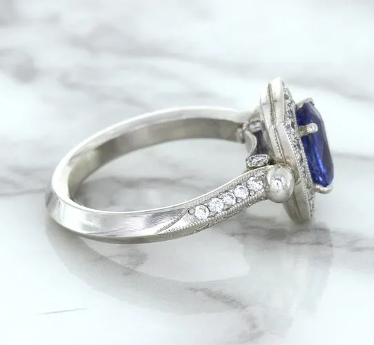 1.56ct Oval Blue Sapphire Ring with Diamond Halo in Platinum