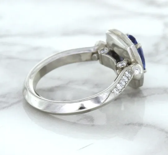 1.56ct Oval Blue Sapphire Ring with Diamond Halo in Platinum