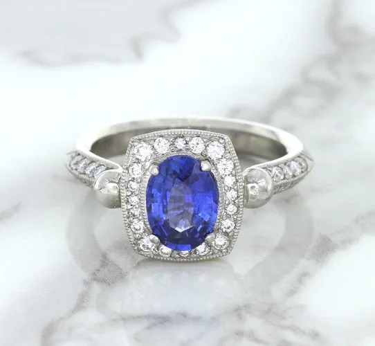1.56ct Oval Blue Sapphire Ring with Diamond Halo in Platinum
