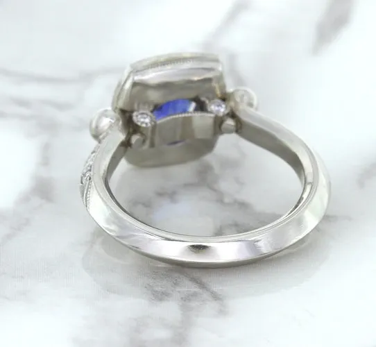 1.56ct Oval Blue Sapphire Ring with Diamond Halo in Platinum