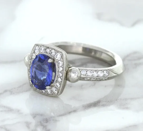 1.56ct Oval Blue Sapphire Ring with Diamond Halo in Platinum