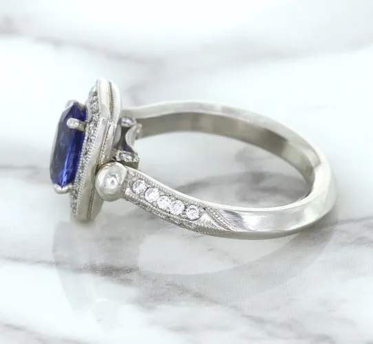 1.56ct Oval Blue Sapphire Ring with Diamond Halo in Platinum