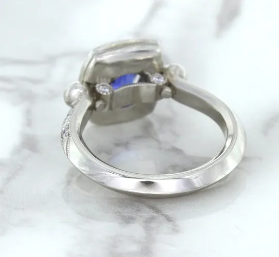 1.56ct Oval Blue Sapphire Ring with Diamond Halo in Platinum