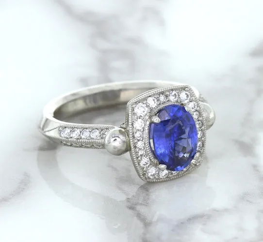 1.56ct Oval Blue Sapphire Ring with Diamond Halo in Platinum