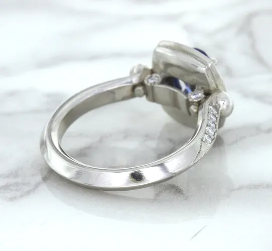 1.56ct Oval Blue Sapphire Ring with Diamond Halo in Platinum