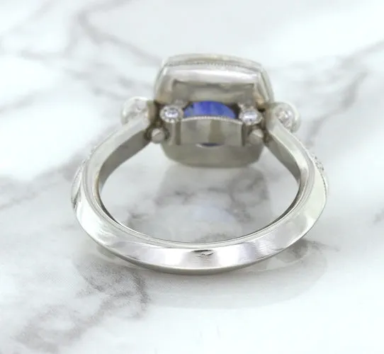 1.56ct Oval Blue Sapphire Ring with Diamond Halo in Platinum