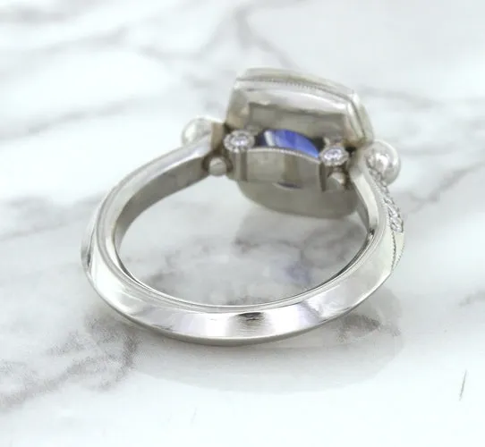 1.56ct Oval Blue Sapphire Ring with Diamond Halo in Platinum