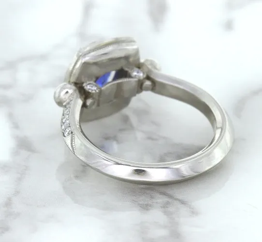 1.56ct Oval Blue Sapphire Ring with Diamond Halo in Platinum