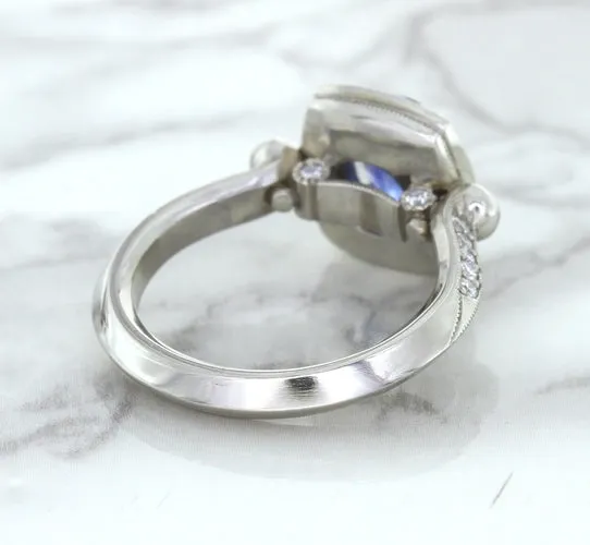 1.56ct Oval Blue Sapphire Ring with Diamond Halo in Platinum