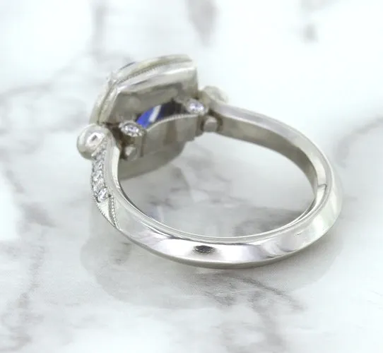 1.56ct Oval Blue Sapphire Ring with Diamond Halo in Platinum