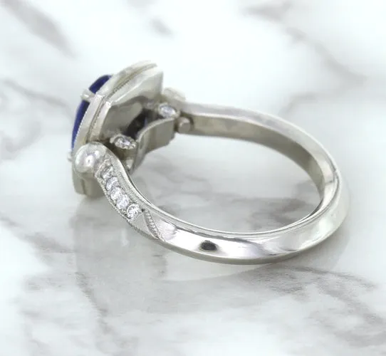 1.56ct Oval Blue Sapphire Ring with Diamond Halo in Platinum