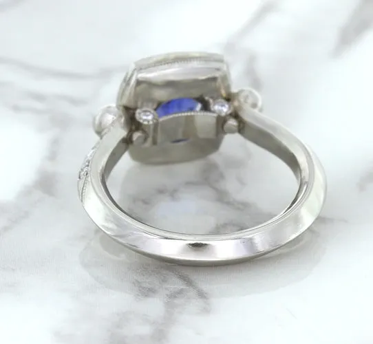 1.56ct Oval Blue Sapphire Ring with Diamond Halo in Platinum