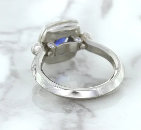1.56ct Oval Blue Sapphire Ring with Diamond Halo in Platinum