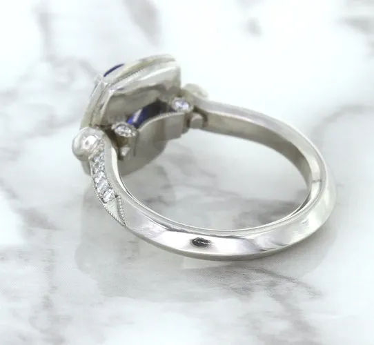 1.56ct Oval Blue Sapphire Ring with Diamond Halo in Platinum