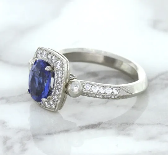 1.56ct Oval Blue Sapphire Ring with Diamond Halo in Platinum