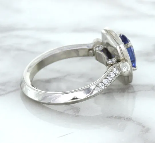 1.56ct Oval Blue Sapphire Ring with Diamond Halo in Platinum