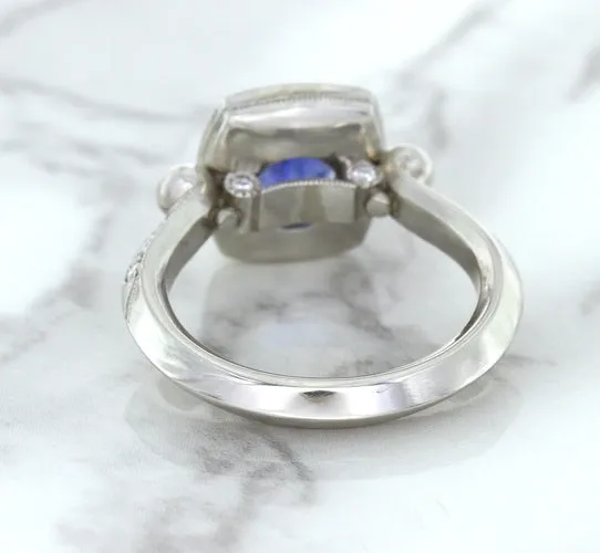 1.56ct Oval Blue Sapphire Ring with Diamond Halo in Platinum