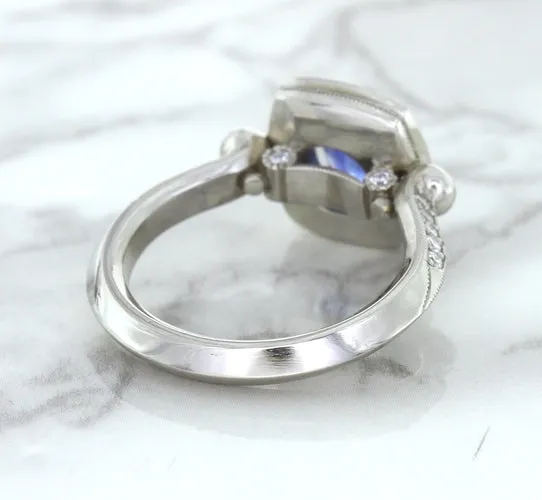 1.56ct Oval Blue Sapphire Ring with Diamond Halo in Platinum