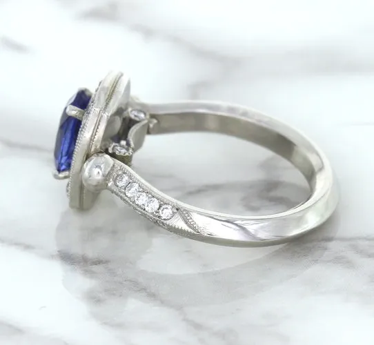 1.56ct Oval Blue Sapphire Ring with Diamond Halo in Platinum