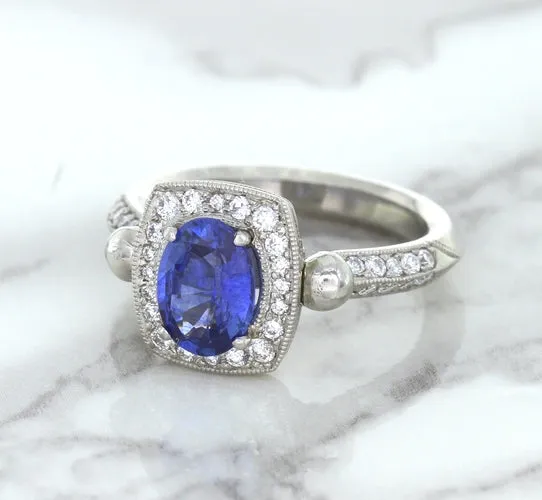1.56ct Oval Blue Sapphire Ring with Diamond Halo in Platinum