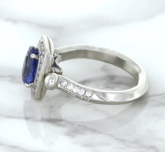 1.56ct Oval Blue Sapphire Ring with Diamond Halo in Platinum