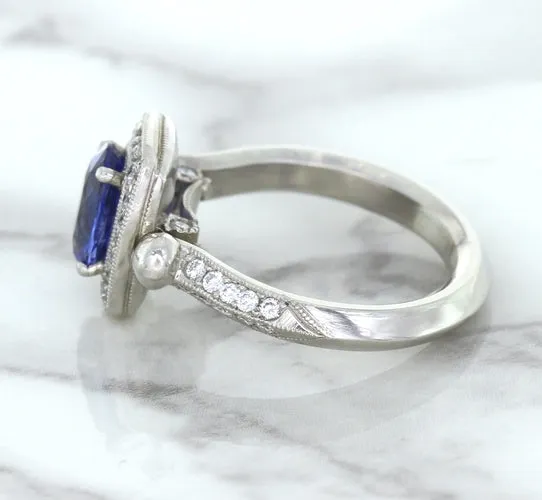 1.56ct Oval Blue Sapphire Ring with Diamond Halo in Platinum