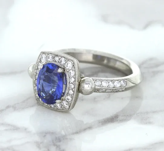 1.56ct Oval Blue Sapphire Ring with Diamond Halo in Platinum