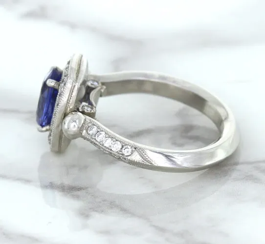 1.56ct Oval Blue Sapphire Ring with Diamond Halo in Platinum
