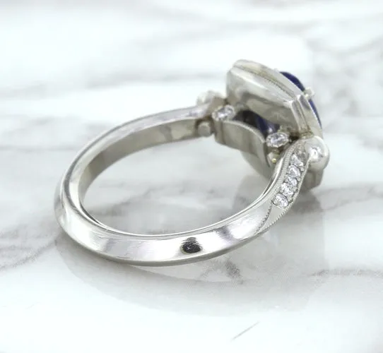 1.56ct Oval Blue Sapphire Ring with Diamond Halo in Platinum