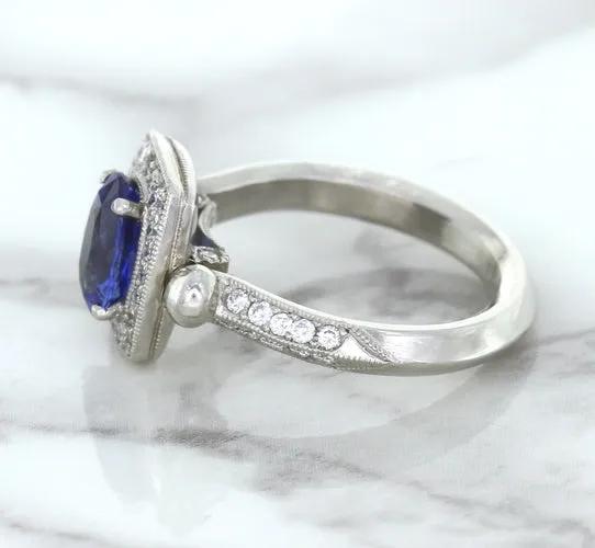 1.56ct Oval Blue Sapphire Ring with Diamond Halo in Platinum