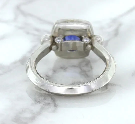 1.56ct Oval Blue Sapphire Ring with Diamond Halo in Platinum