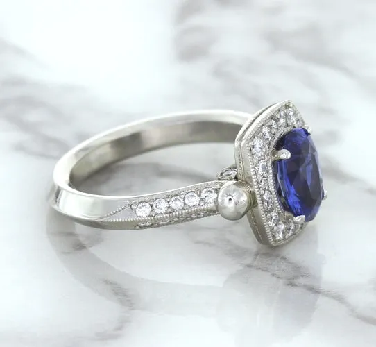1.56ct Oval Blue Sapphire Ring with Diamond Halo in Platinum