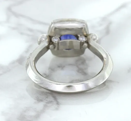 1.56ct Oval Blue Sapphire Ring with Diamond Halo in Platinum