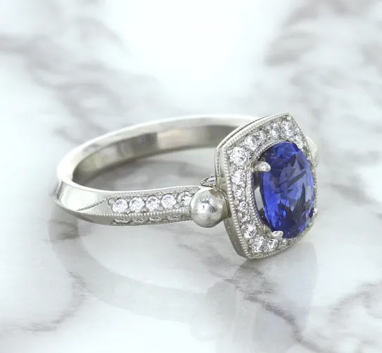 1.56ct Oval Blue Sapphire Ring with Diamond Halo in Platinum