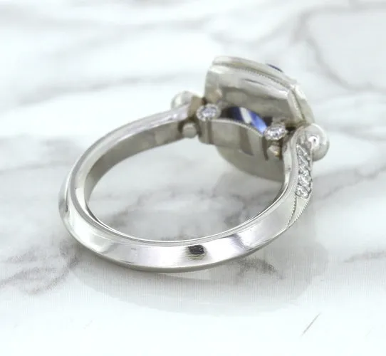 1.56ct Oval Blue Sapphire Ring with Diamond Halo in Platinum
