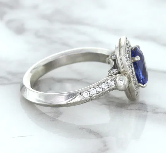 1.56ct Oval Blue Sapphire Ring with Diamond Halo in Platinum