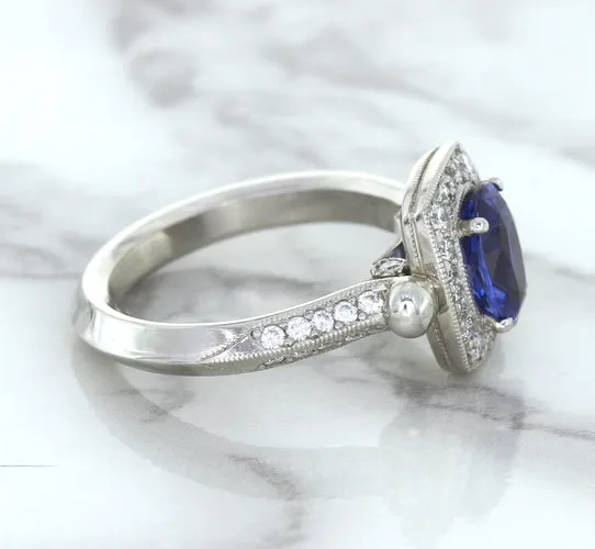 1.56ct Oval Blue Sapphire Ring with Diamond Halo in Platinum