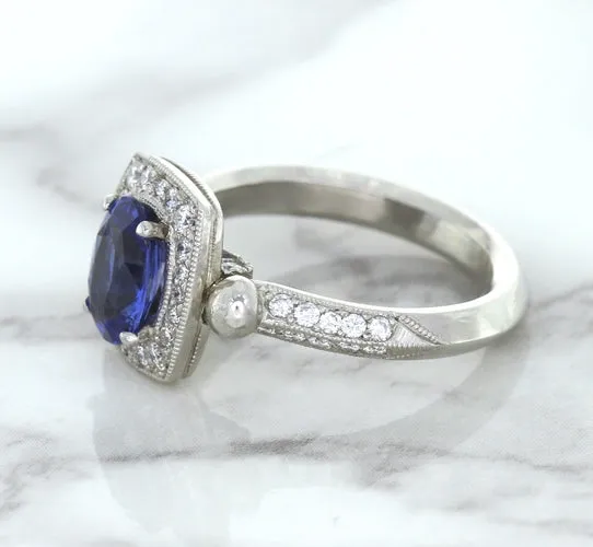1.56ct Oval Blue Sapphire Ring with Diamond Halo in Platinum