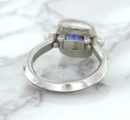 1.56ct Oval Blue Sapphire Ring with Diamond Halo in Platinum
