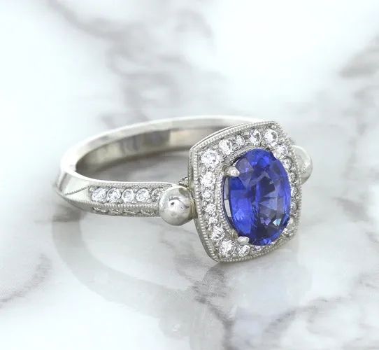 1.56ct Oval Blue Sapphire Ring with Diamond Halo in Platinum