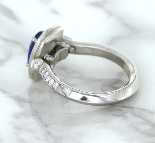 1.56ct Oval Blue Sapphire Ring with Diamond Halo in Platinum